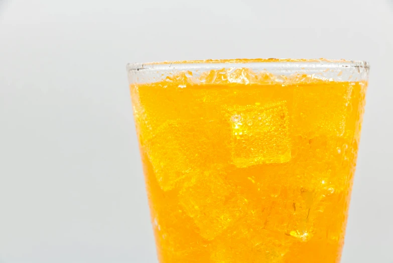 a close up of a glass filled with juice