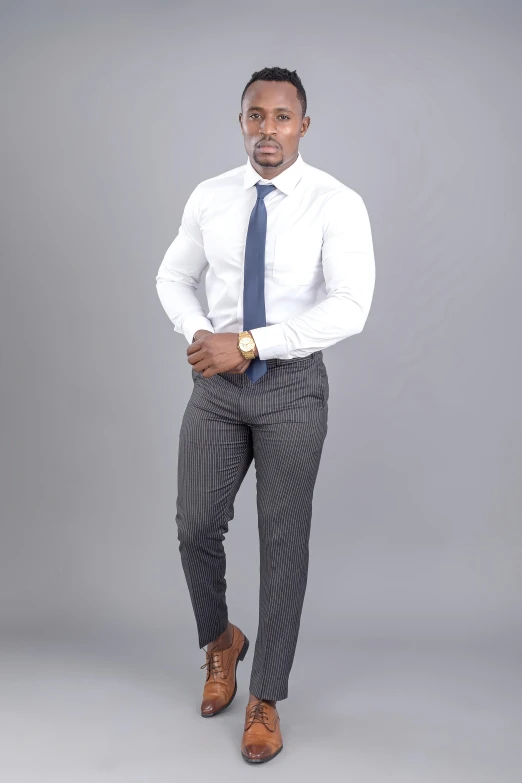 an african man in a dress shirt, tie and pants