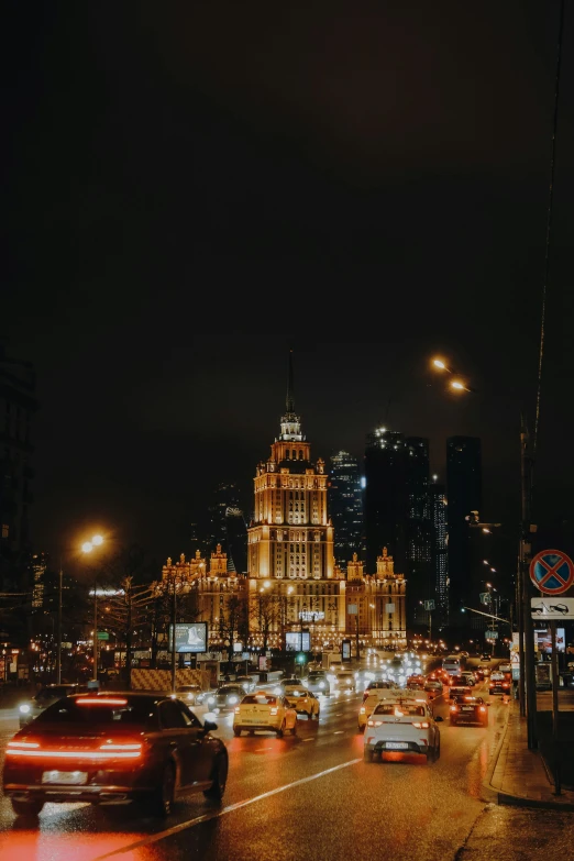 city traffic is shown at night as the lights are on