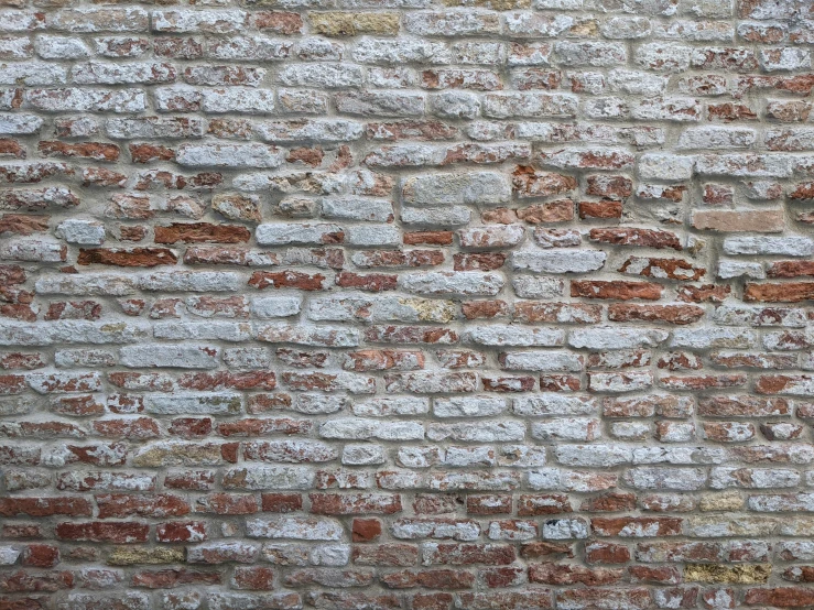 an old brick wall made of several bricks