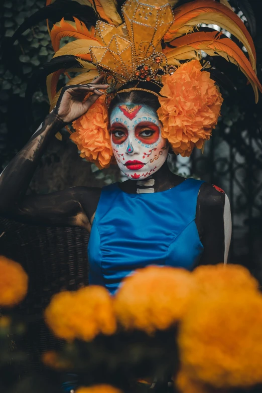 a woman with painted face and yellow flowers