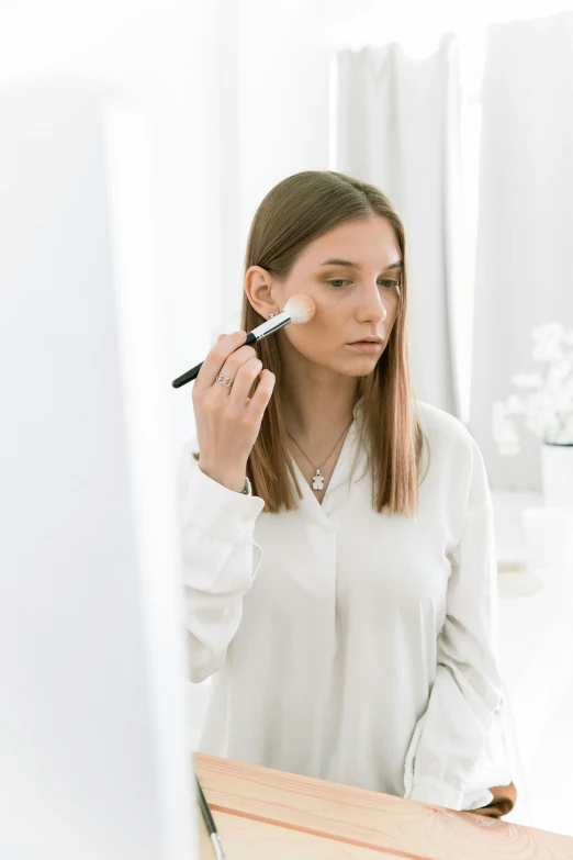 a woman getting ready for her next beauty trick