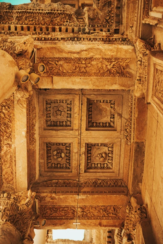 the ceiling is very decorated with carvings and designs