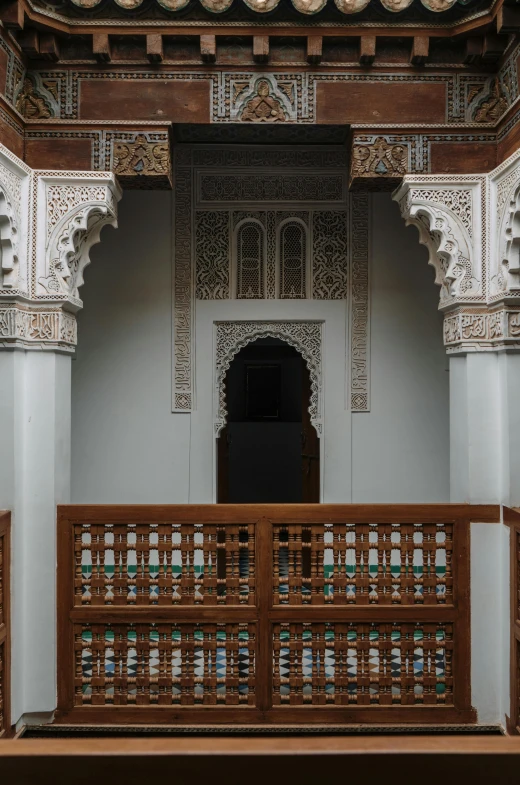 the balcony of a building with a wooden fence