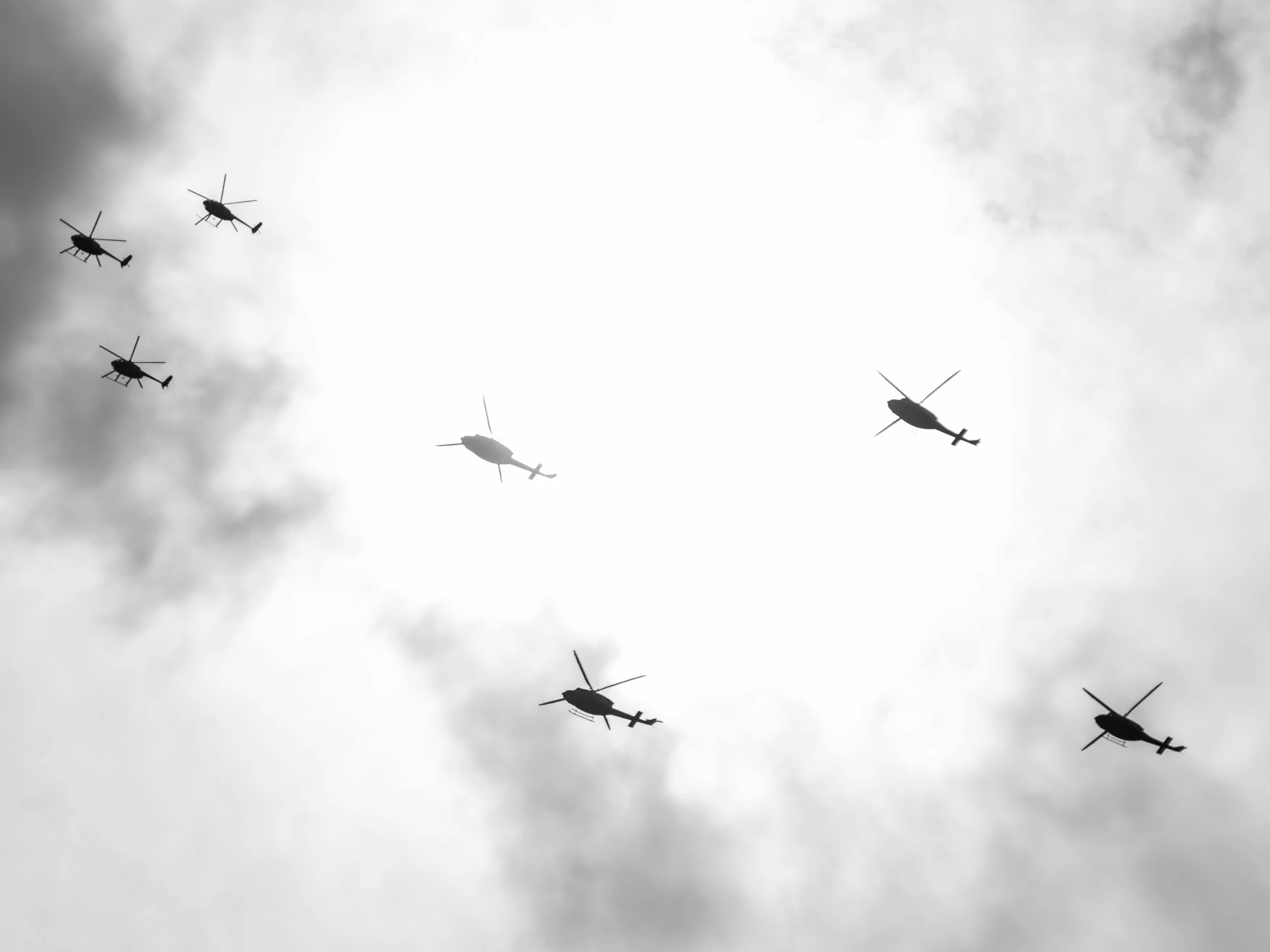 a number of helicopter flying in the air