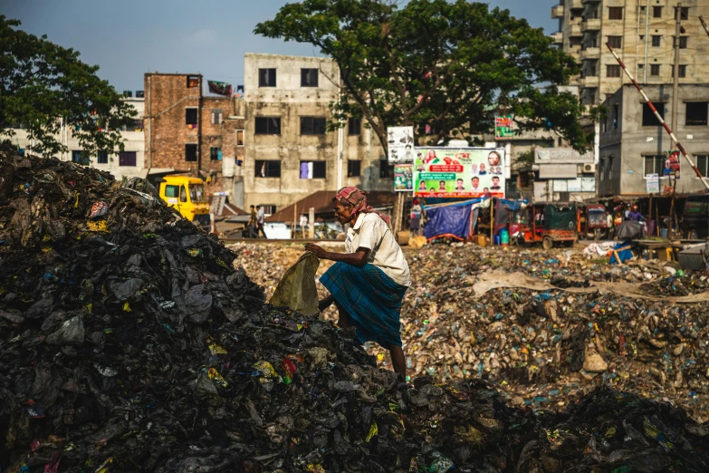 an image of woman dumping trash at the rubbish