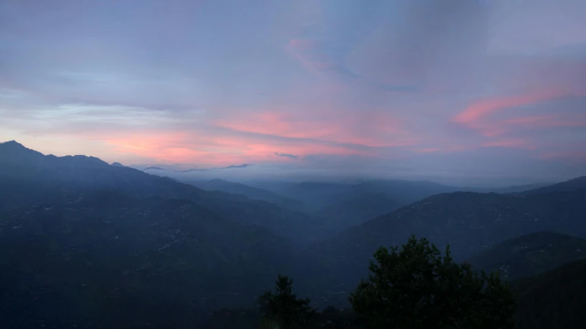 the sky is full of pink clouds and blue sky