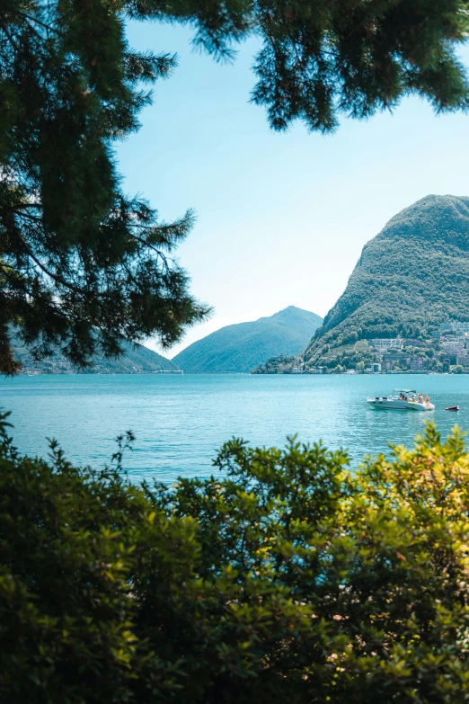 a body of water with mountains in the background