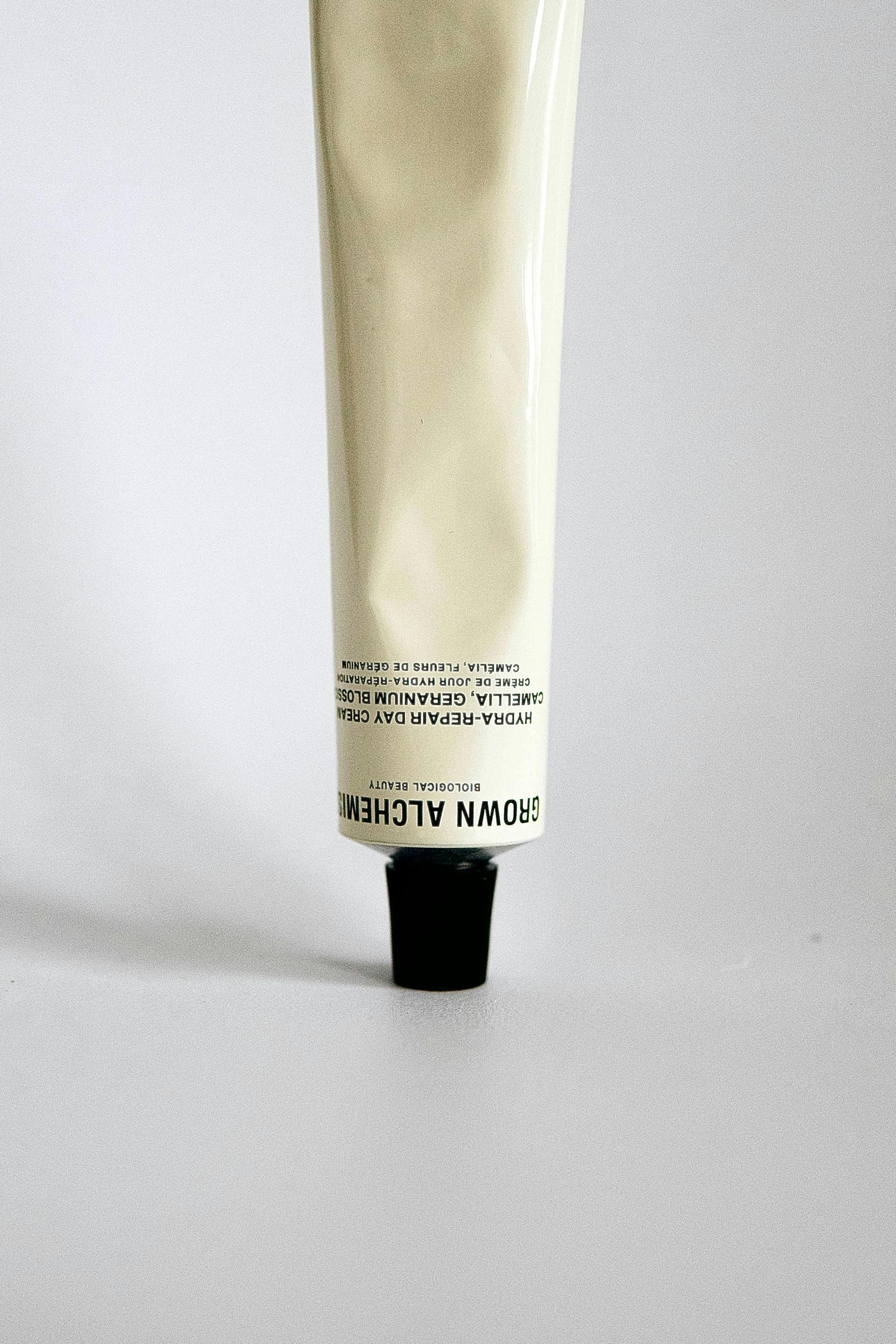 a tube of creamy, hand cream is sitting on a counter