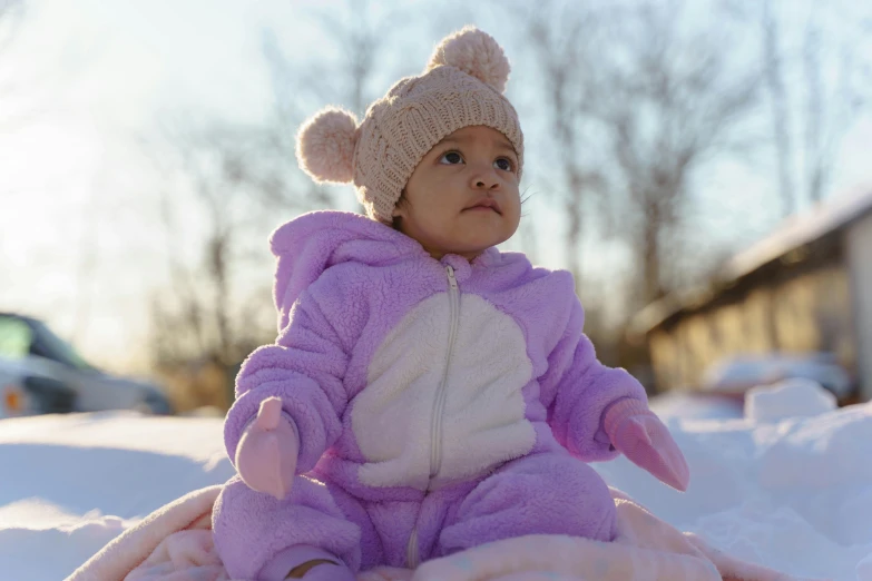 the young baby is dressed in her animal costume