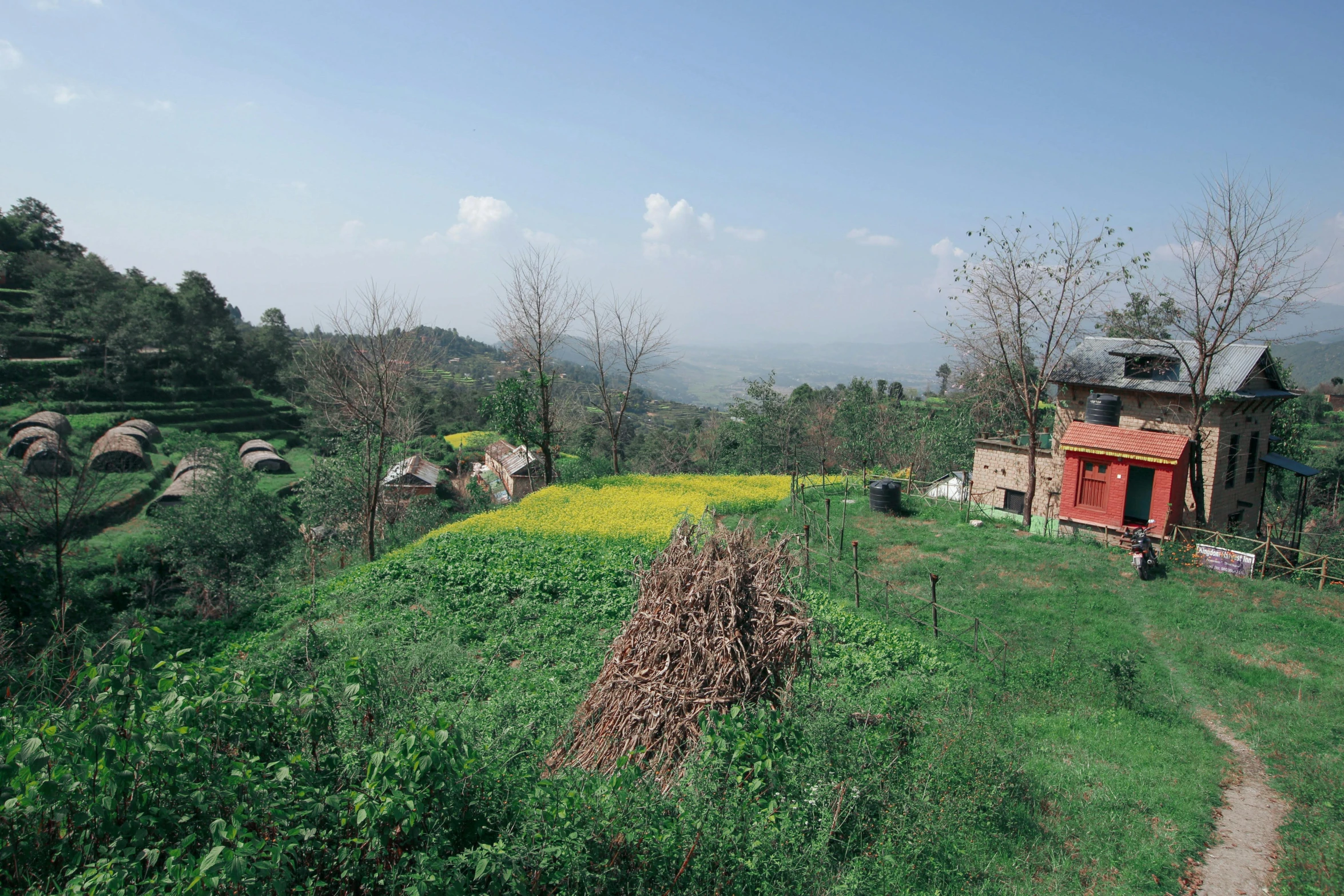 there is a small house in a field