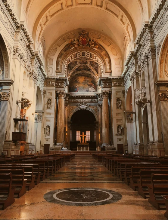 an ornate church with a large stone alter