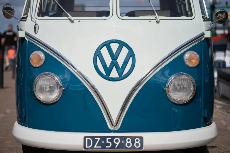 a van has an emblem on it as it sits in the street