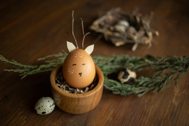 the brown egg has an animal head as its face