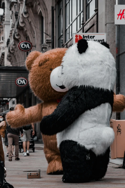 a couple of large stuffed bears standing next to each other
