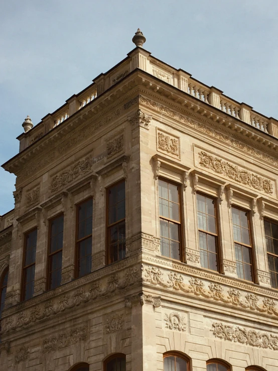 an old building with two clocks mounted to it's sides