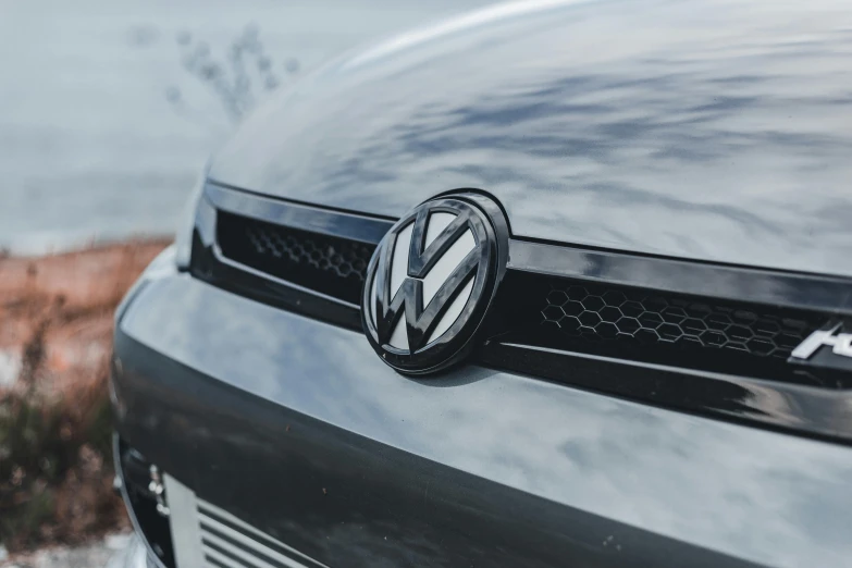 the front badge of a black volkswagen car