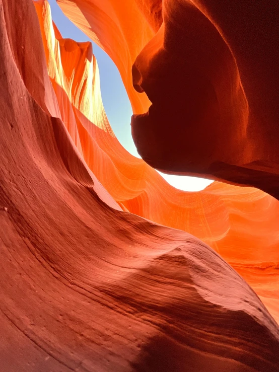 sunlight peeks through the walls of this slot in the navajo desert