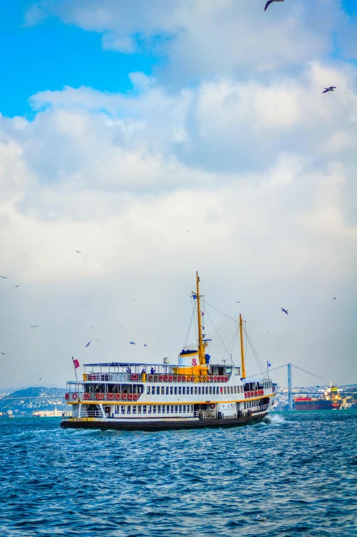 a large yellow boat floating on top of the ocean