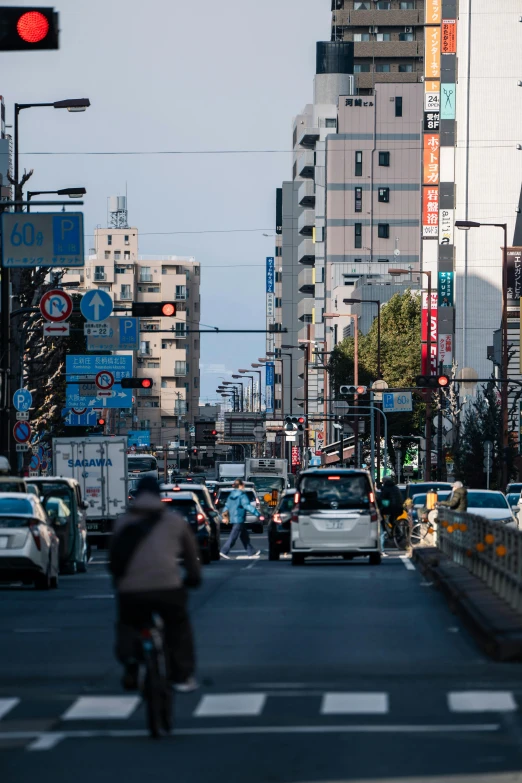 the people are biking around a busy street