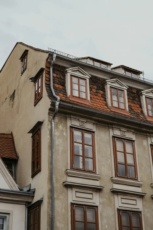 a building with several windows that look up at the sky