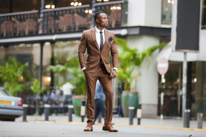 a man in a suit walks on the street