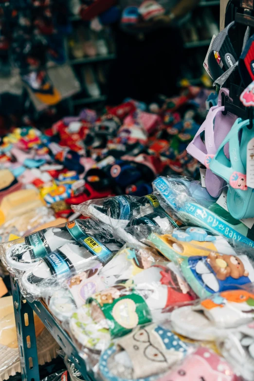 rows of colorful baby's pacypants and underwear on a table