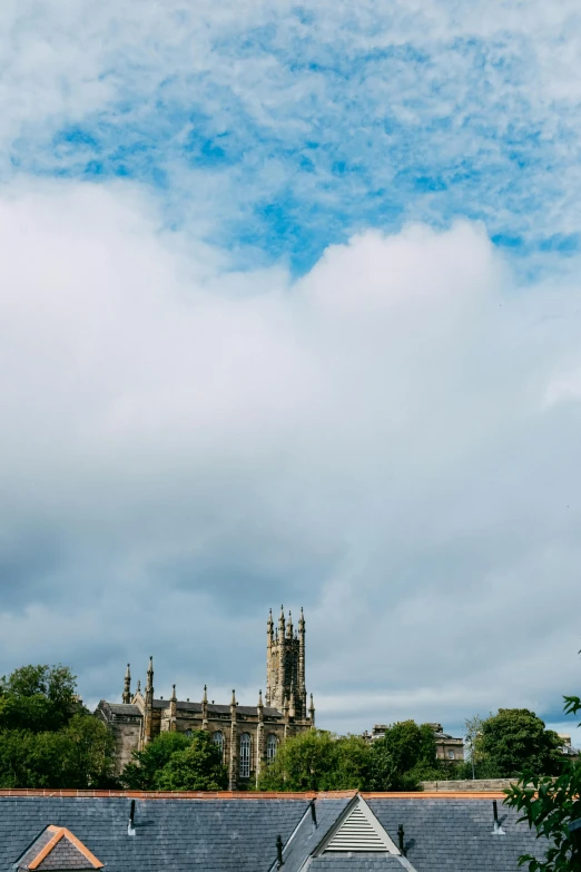 a very tall cathedral sitting behind a castle