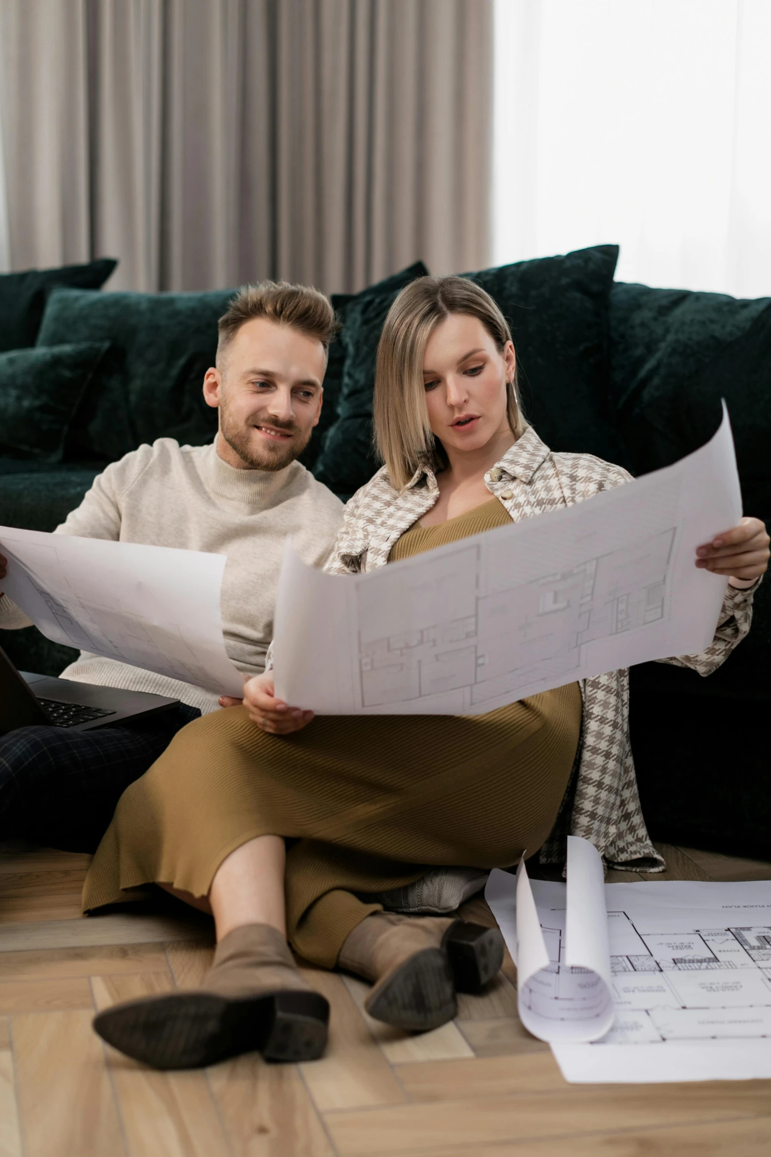 a man and woman sitting on the floor together