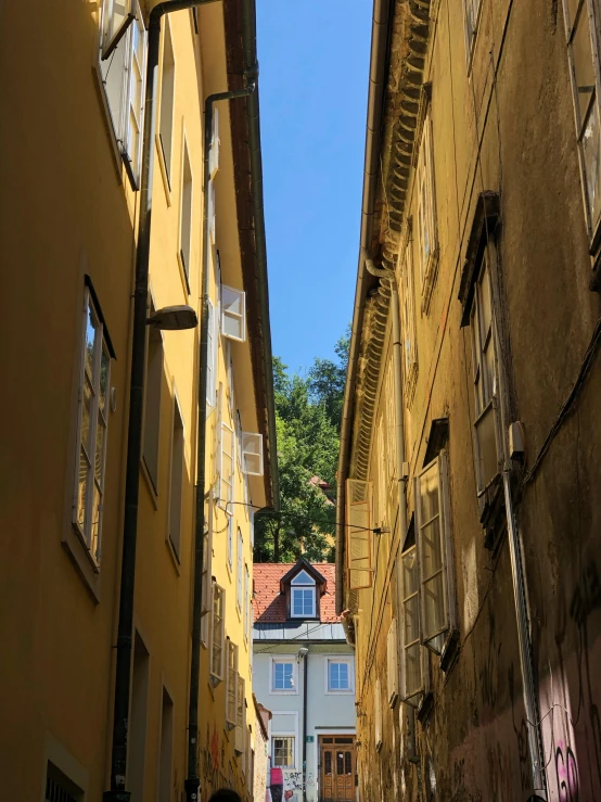 a person is walking up a narrow street