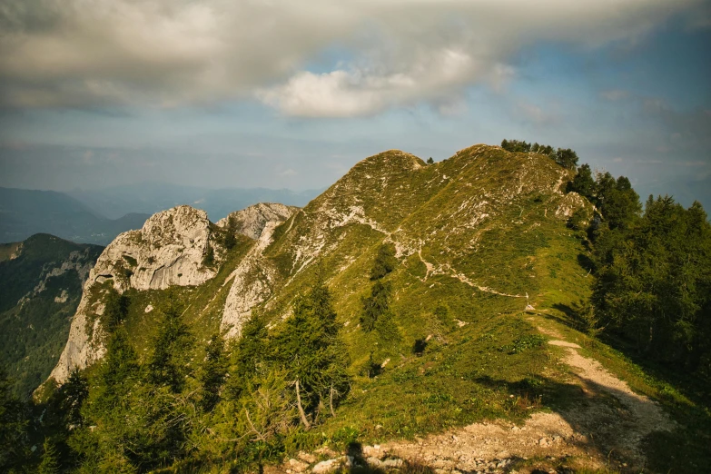 the view from the top of the mountain of rocks and trees on the far side