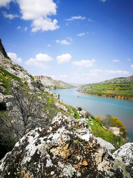 the view of the mountain lake with sky and clouds