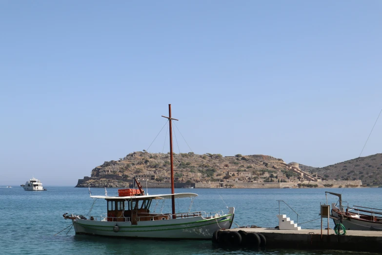 boats are parked in the water at a dock