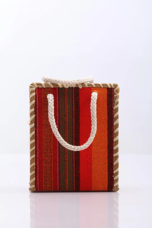 a purse with a handle on a white background