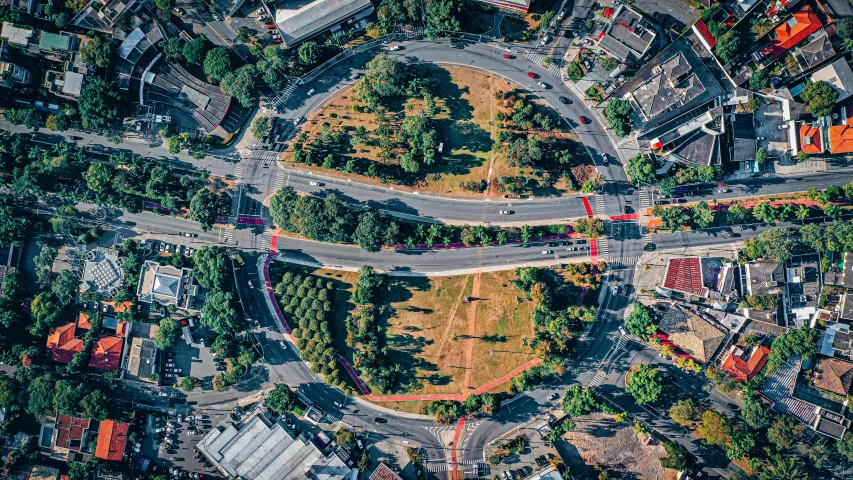 an overhead view of a city intersection in the daytime