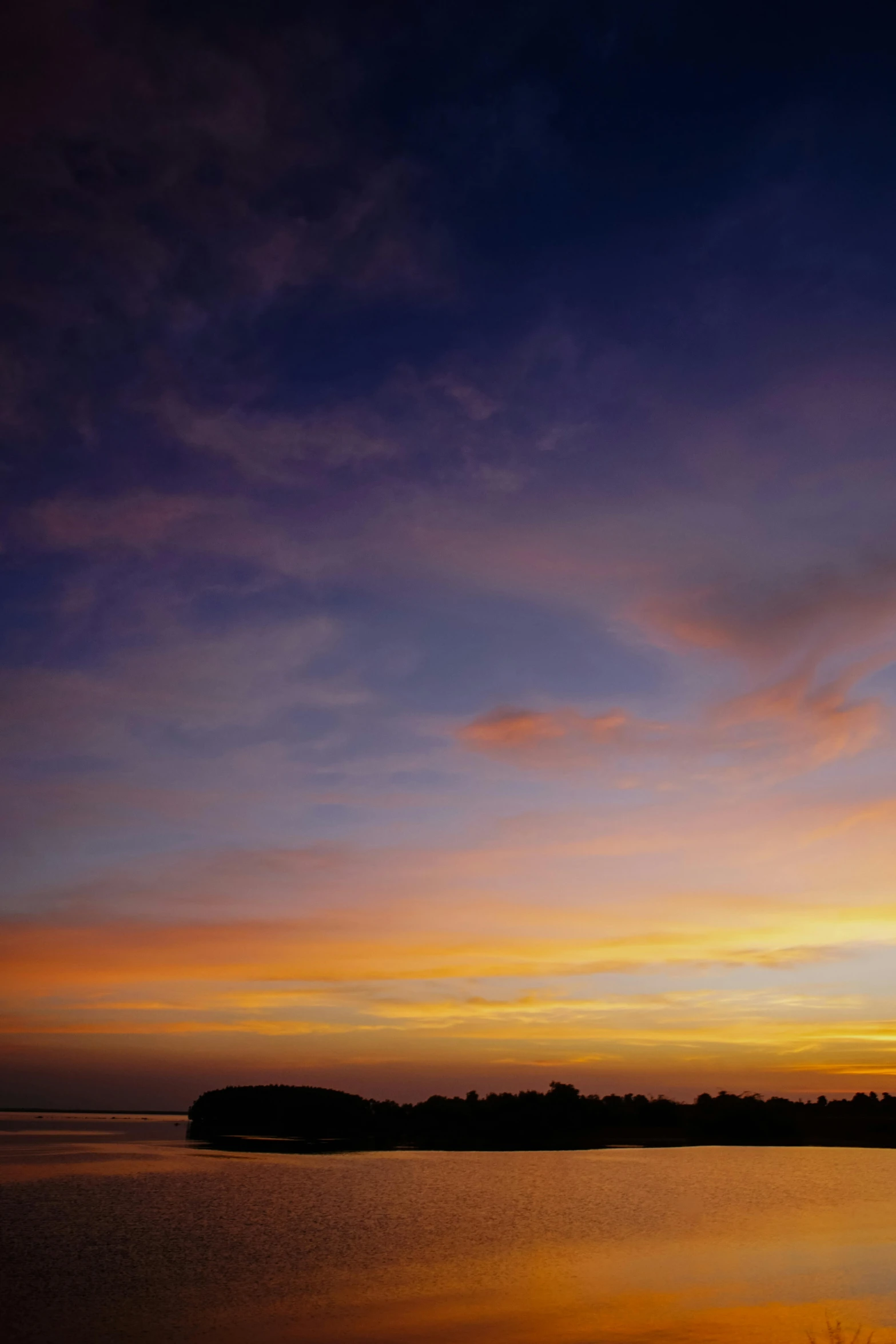 colorful clouds reflected in a body of water