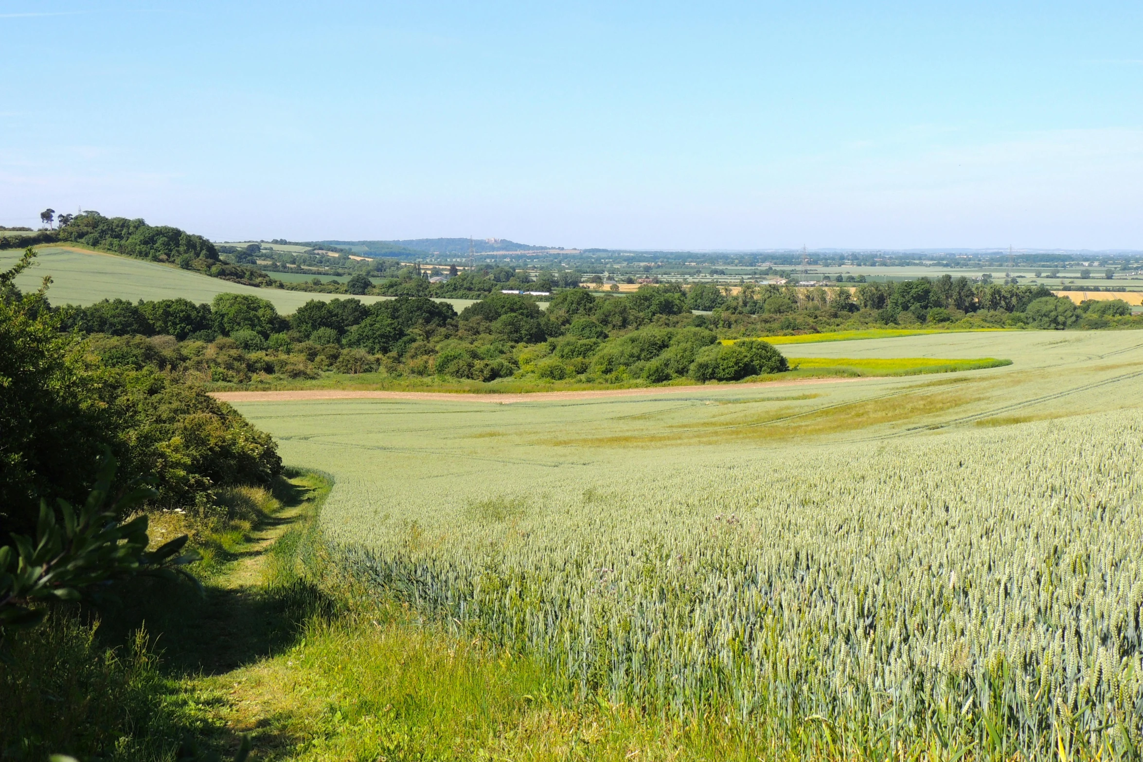 a long road runs through the countryside