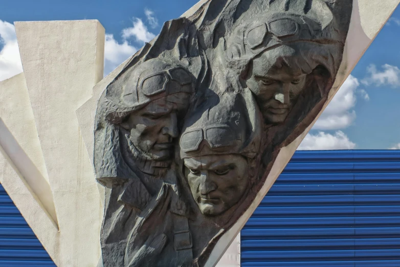 two statues made of cement on the outside