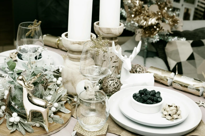 the table is set with candles and dishes