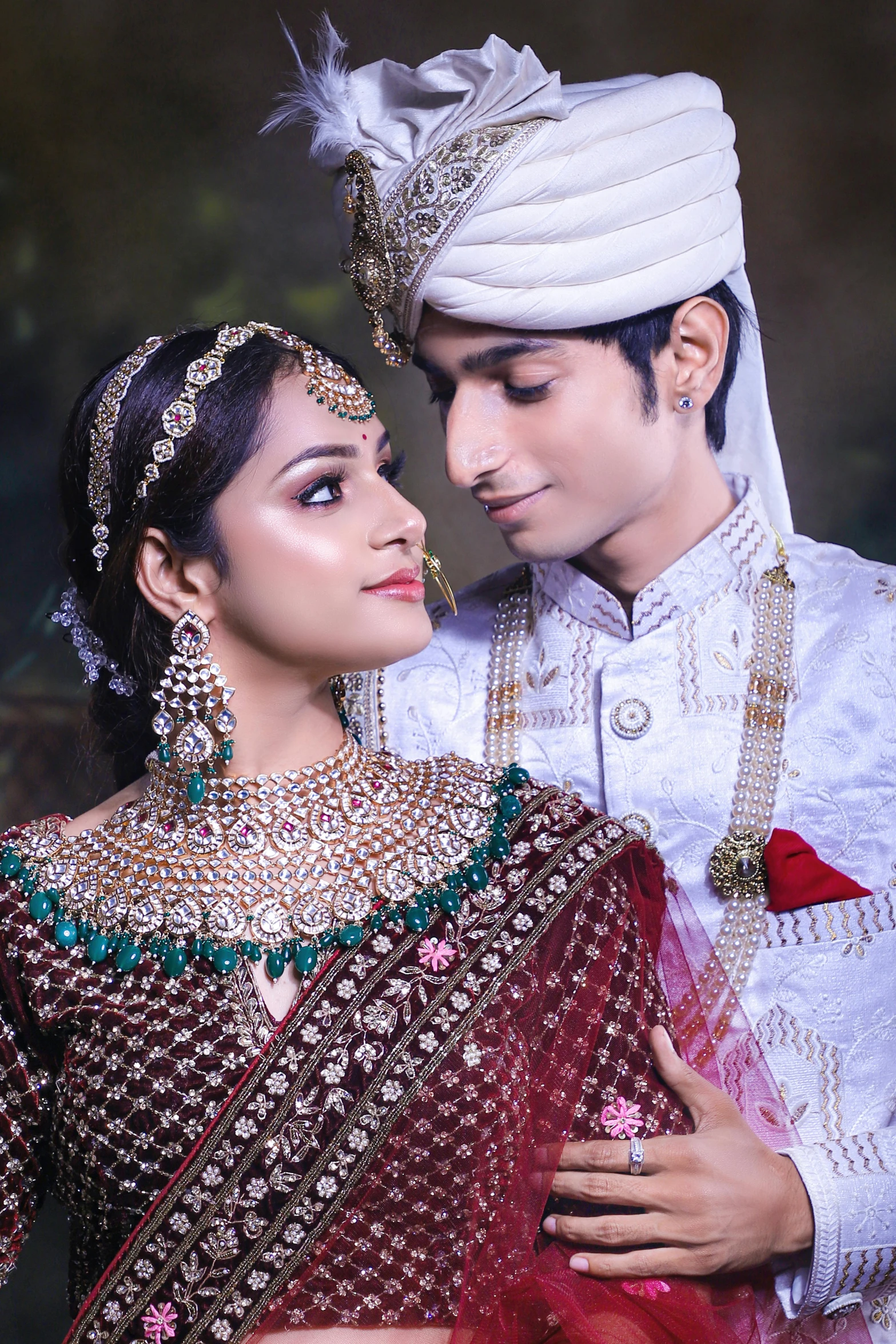 man in a white turban and a beautiful woman standing close together