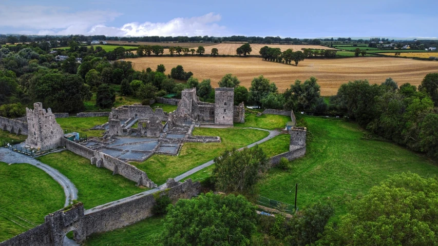 a large castle near a lush green forest