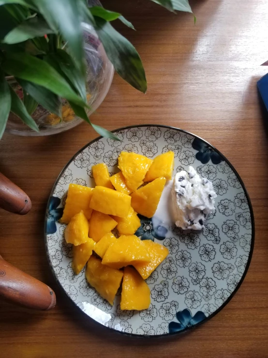 some fruit on a plate with whipped cream on it