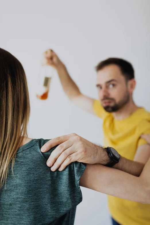 a man putting the hair back to a beautiful woman