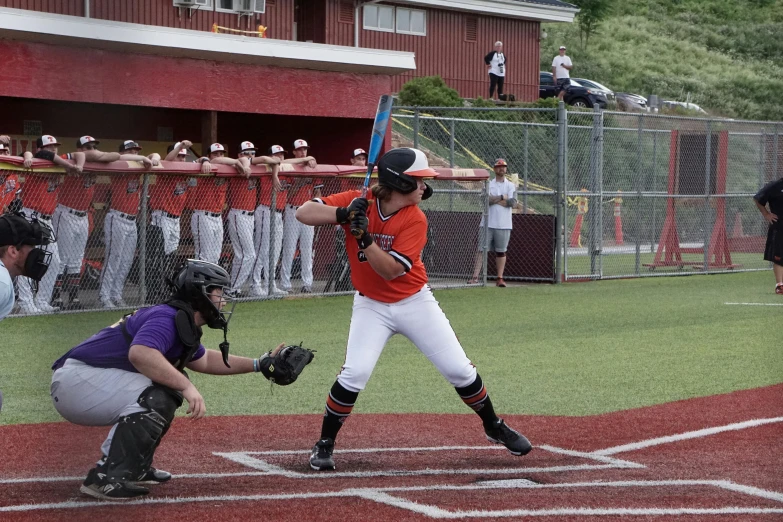 a baseball player holding a bat during a game