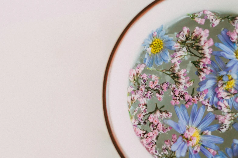 a plate is shown with a floral fabric covering