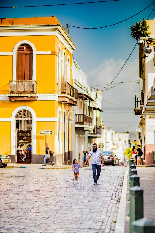 a man walking next to a woman holding hands