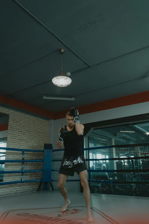 an individual taking a po inside a boxing ring