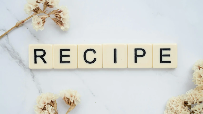 a tiled word with words on it that spell out recipe