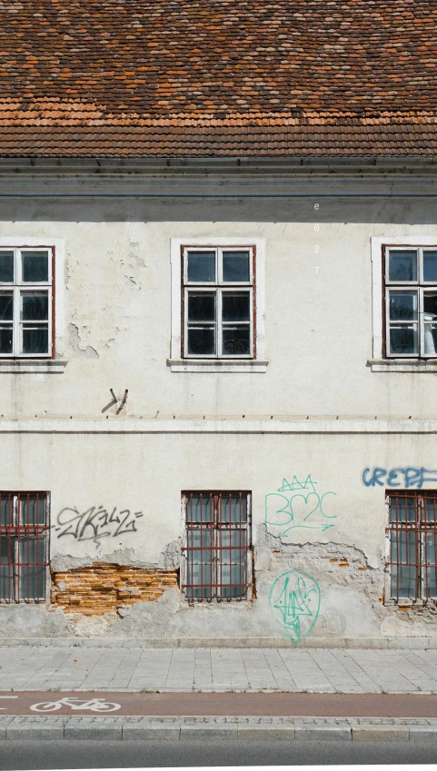 the graffiti is all over the wall of the building