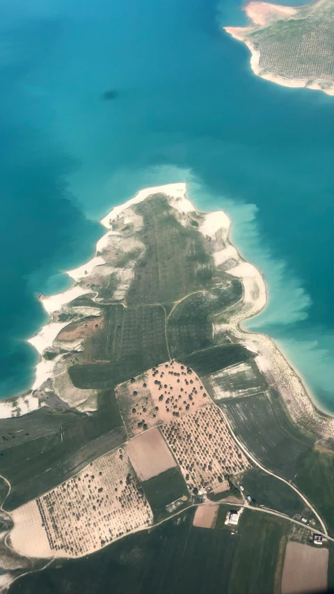 an aerial view of a tropical island in the ocean